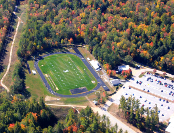 Fall scenic flight over Kennett High School grounds and athletic field in North Conway, New Hampshire